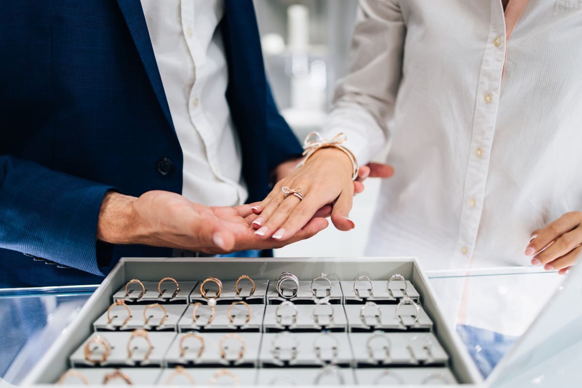 A couple trying on engagement rings