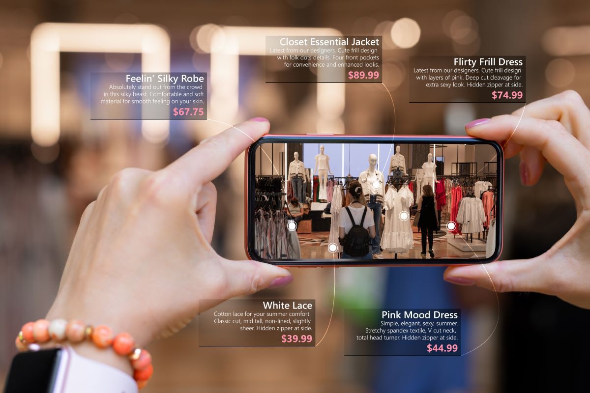  A woman is holding a smartphone with a virtual reality shopping experience.